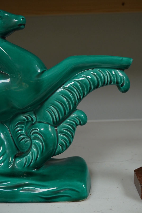 A French Art Deco ceramic antelope with green glaze, 46cm high. Condition - good